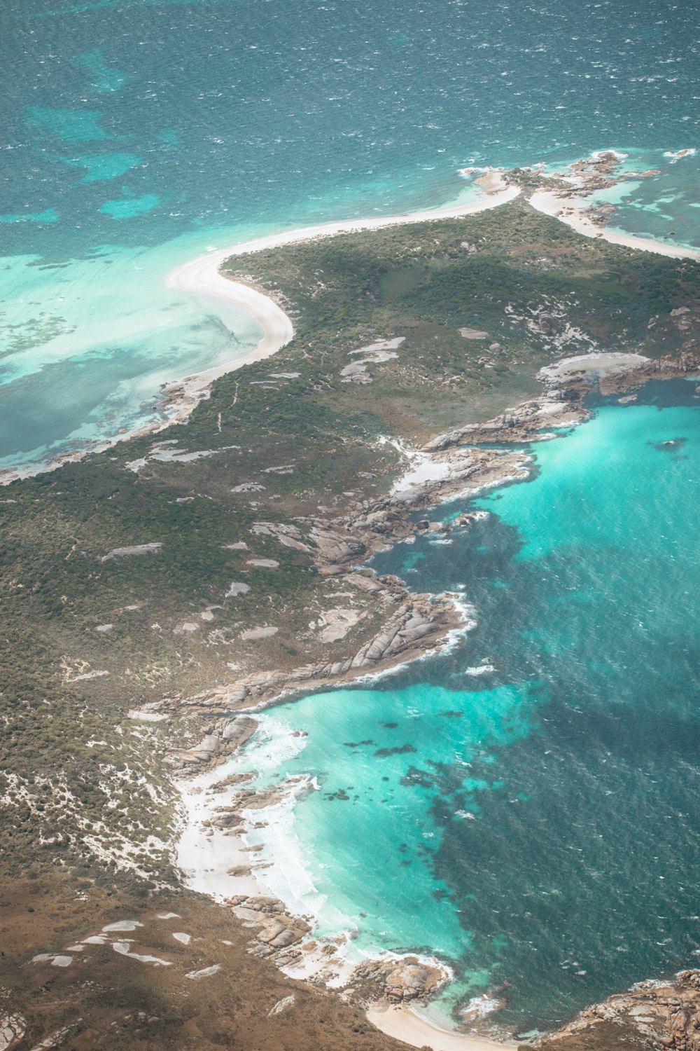 an aerial view of an island and a body of water