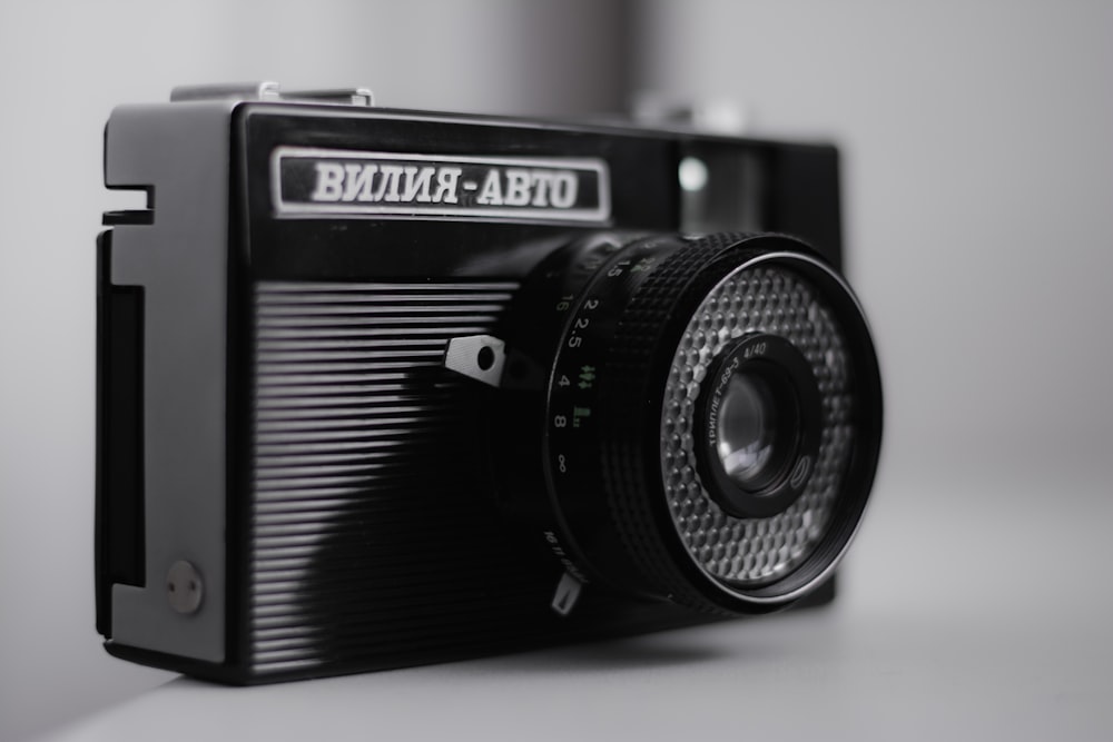 a black camera sitting on top of a table