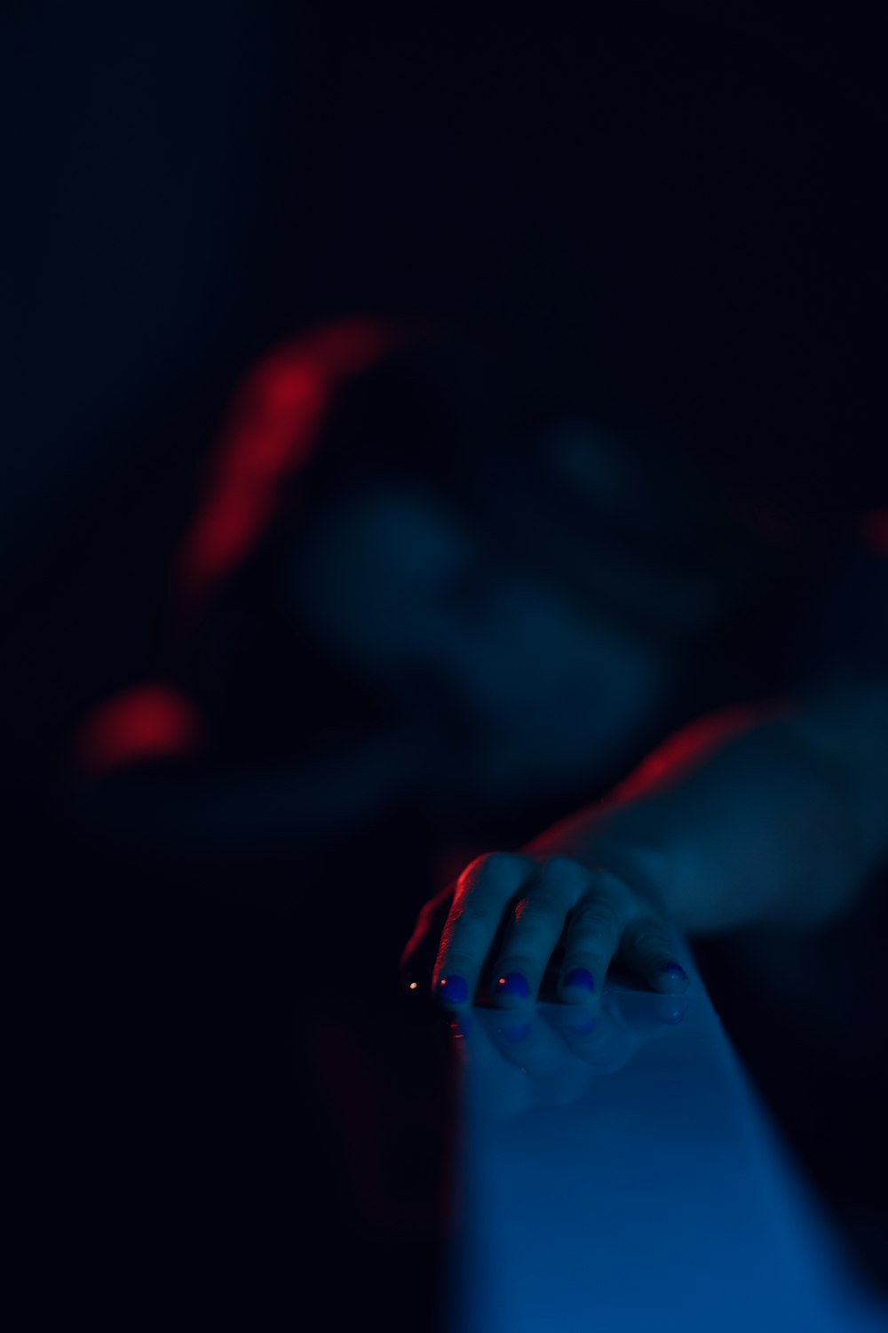 a person using a computer mouse in a dark room