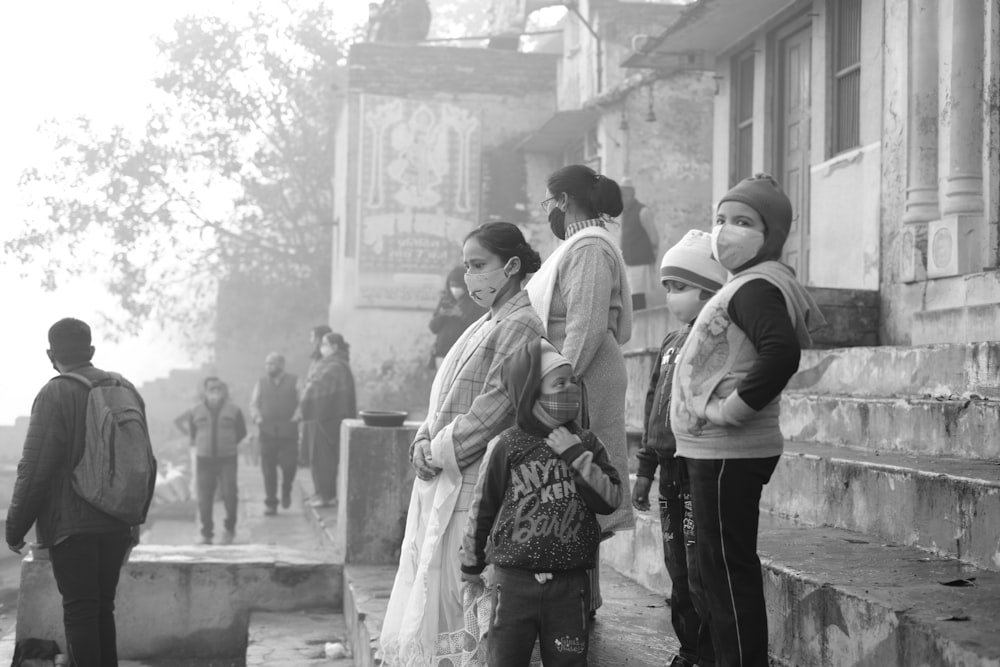 a group of people standing in front of a building