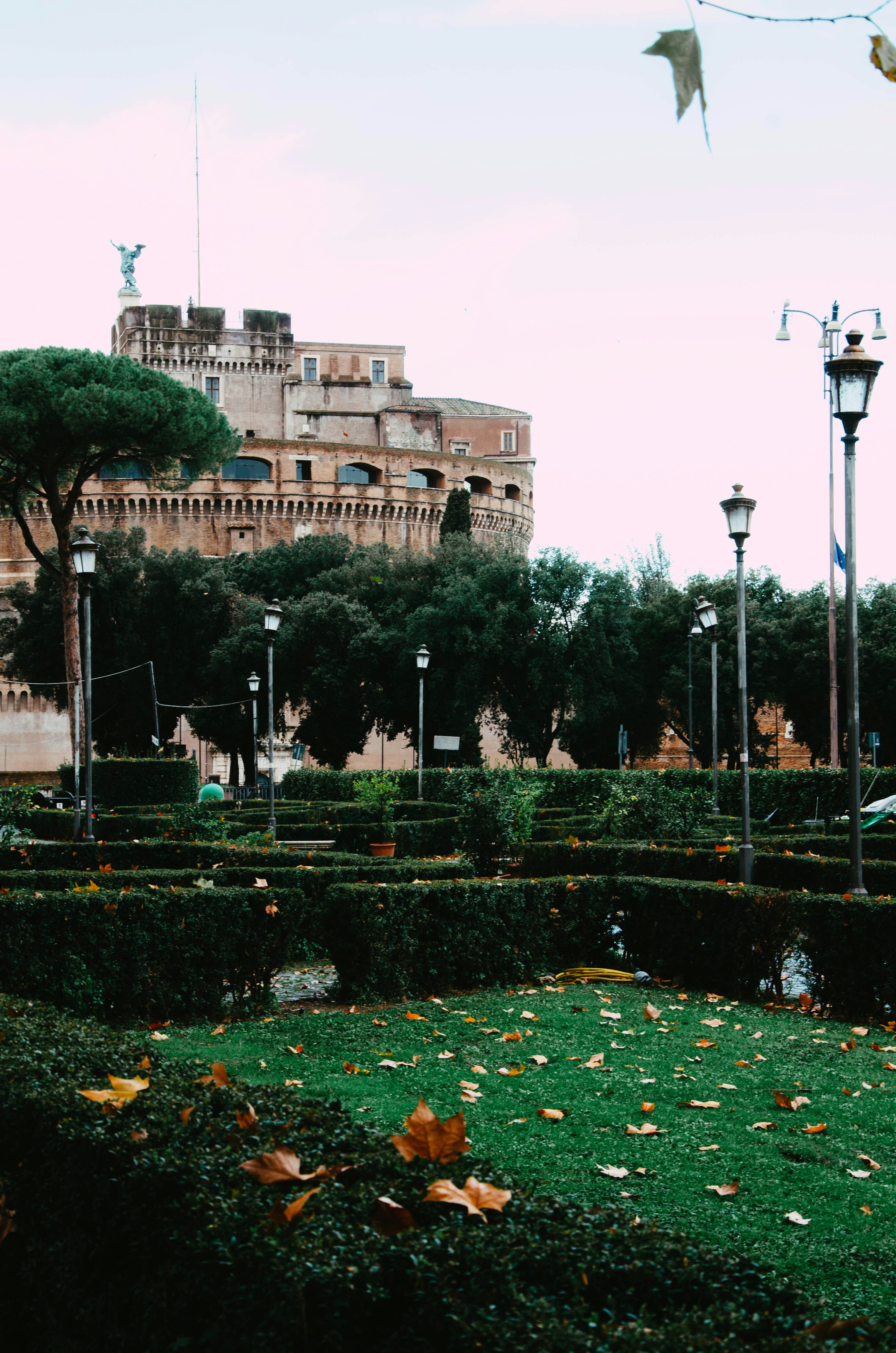 a park with a clock tower in the background