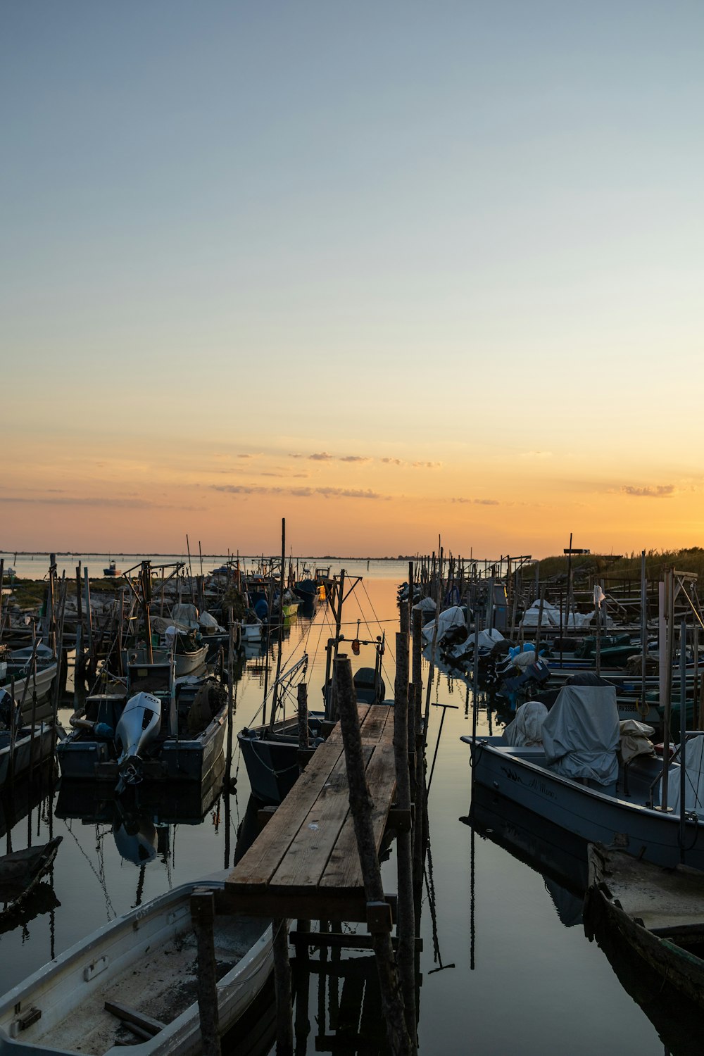 a group of boats that are sitting in the water