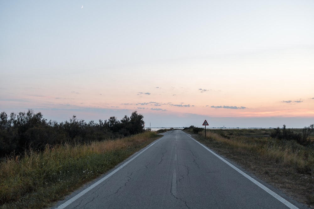 a road with a sign on the side of it