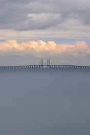 a large long bridge spanning over a large body of water