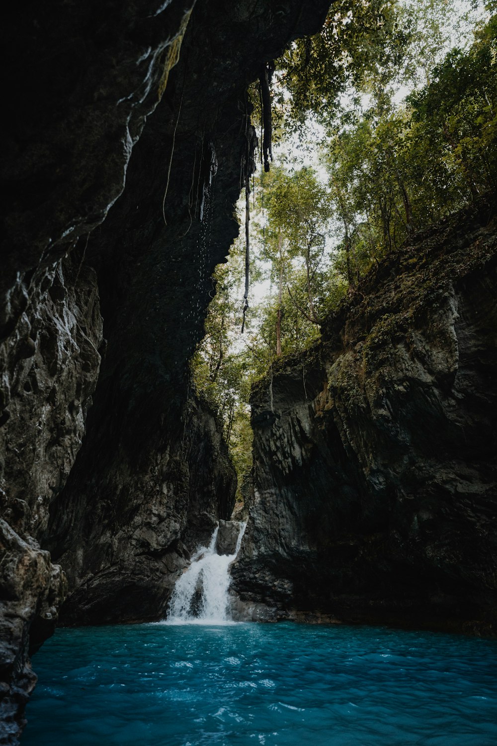 a small waterfall in the middle of a river