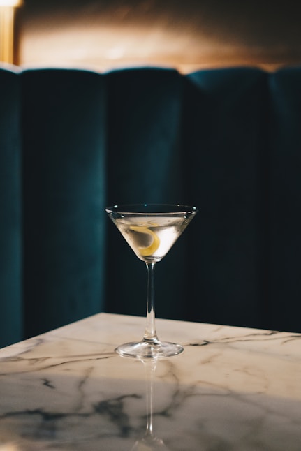 a martini sitting on top of a marble counter