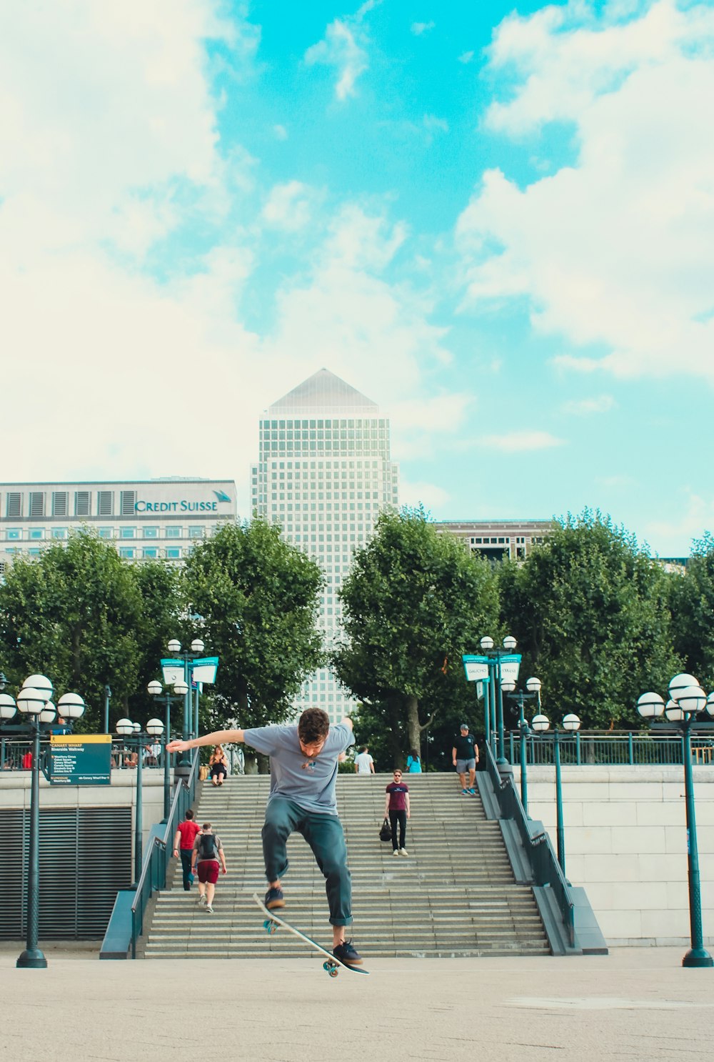 a man riding a skateboard down the side of a flight of stairs