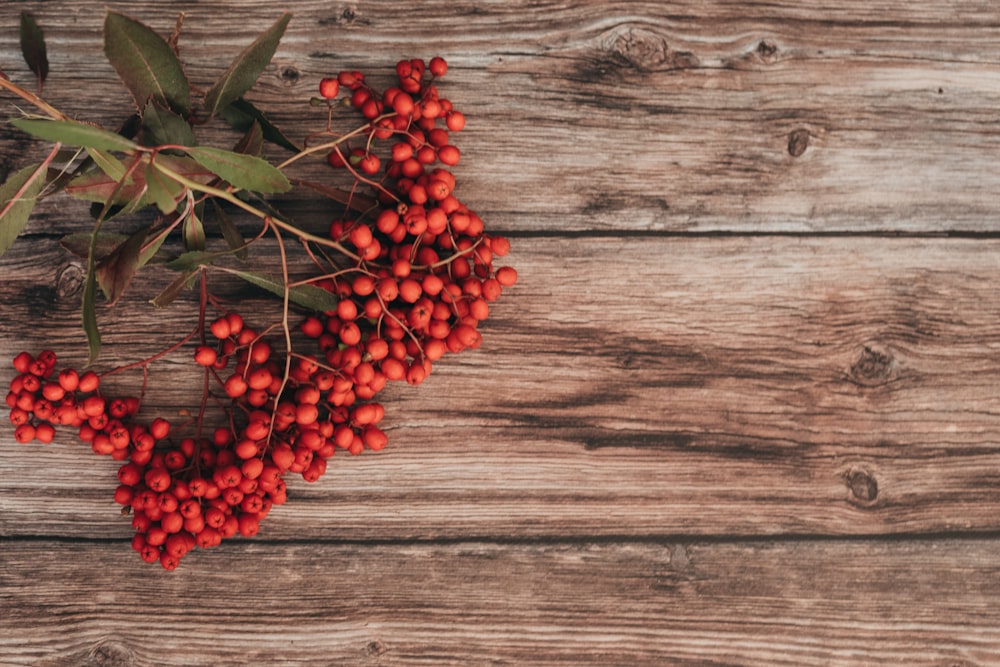 a bunch of berries sitting on top of a wooden table