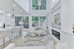 a living room filled with furniture and a fire place