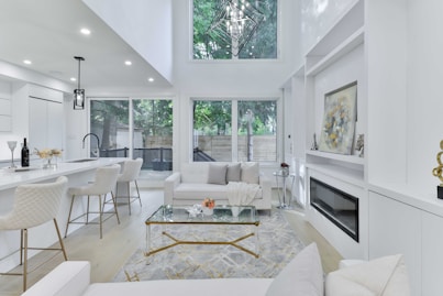 a living room filled with furniture and a fire place