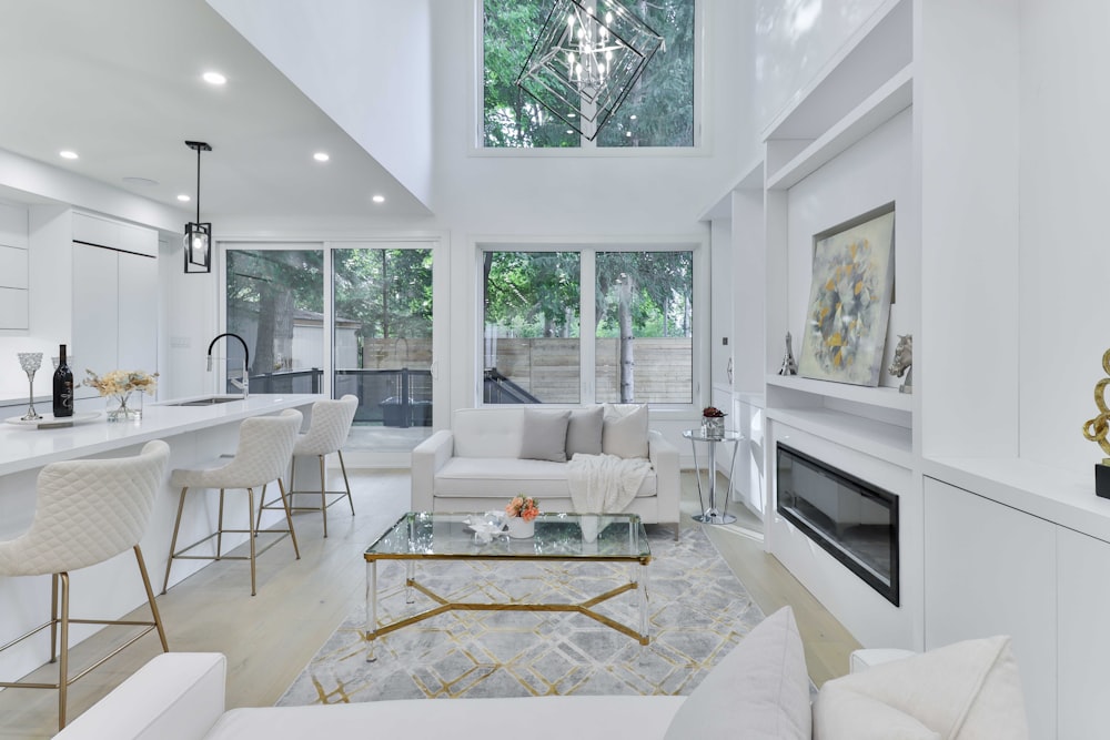 a living room filled with furniture and a fire place