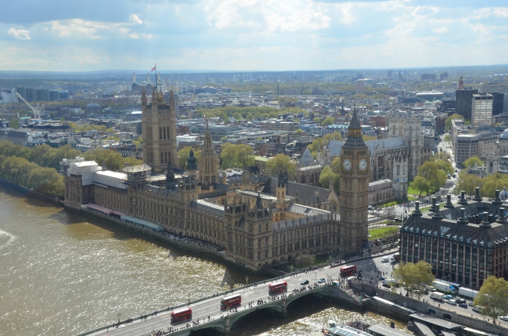 an aerial view of a city with a bridge in the foreground