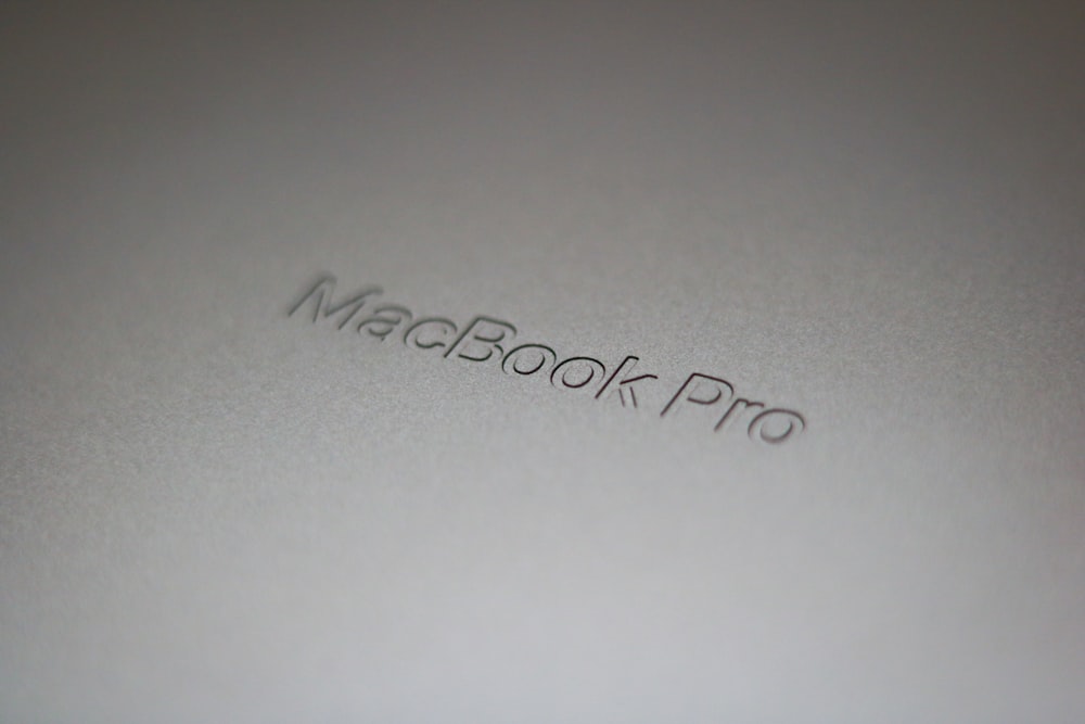 a close up of a macbook pro logo