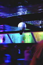 a disco ball sitting on top of a stage