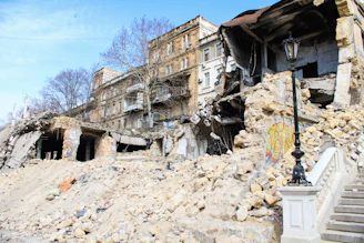 a large pile of rubble next to a building