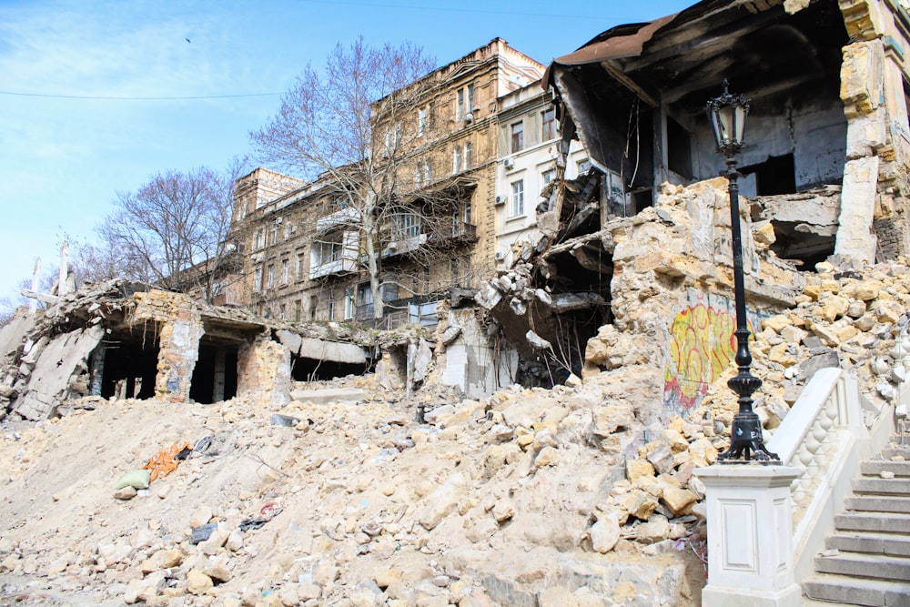 a large pile of rubble next to a building