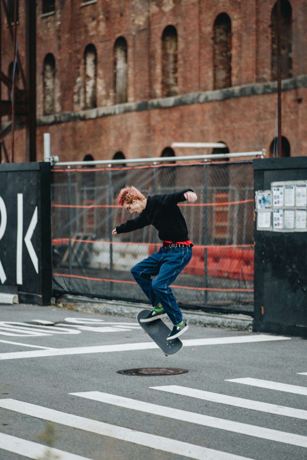 a young man riding a skateboard through the air