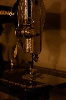 an old sewing machine is sitting on a table