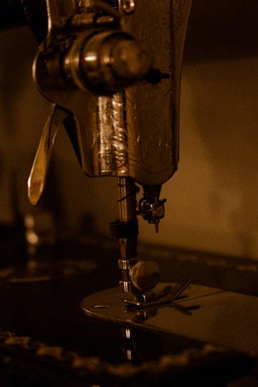 a close up of a sewing machine on a table