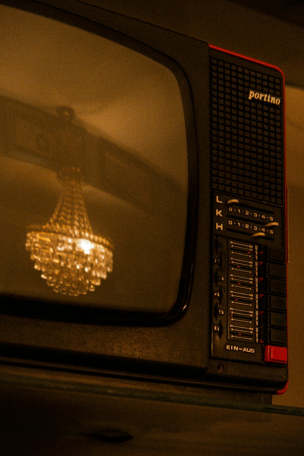 an old television with a light bulb on it