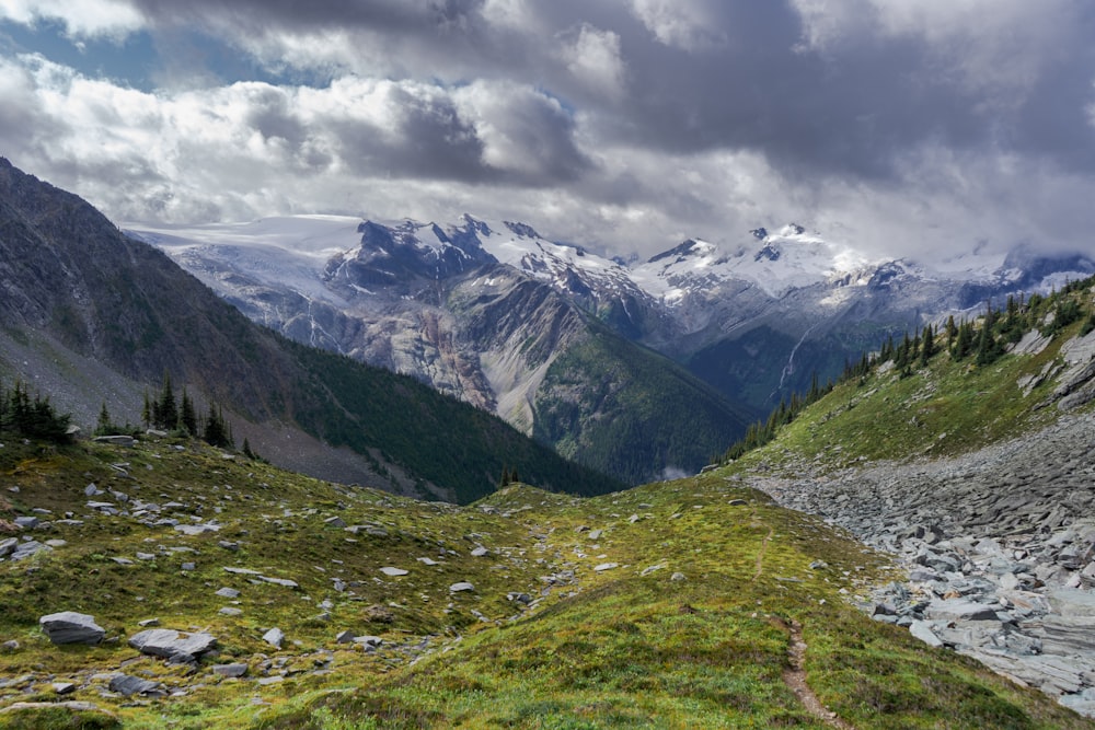 a view of a valley with mountains in the background