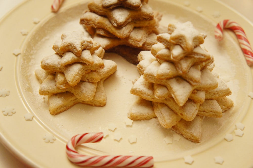 a white plate topped with cookies and candy canes