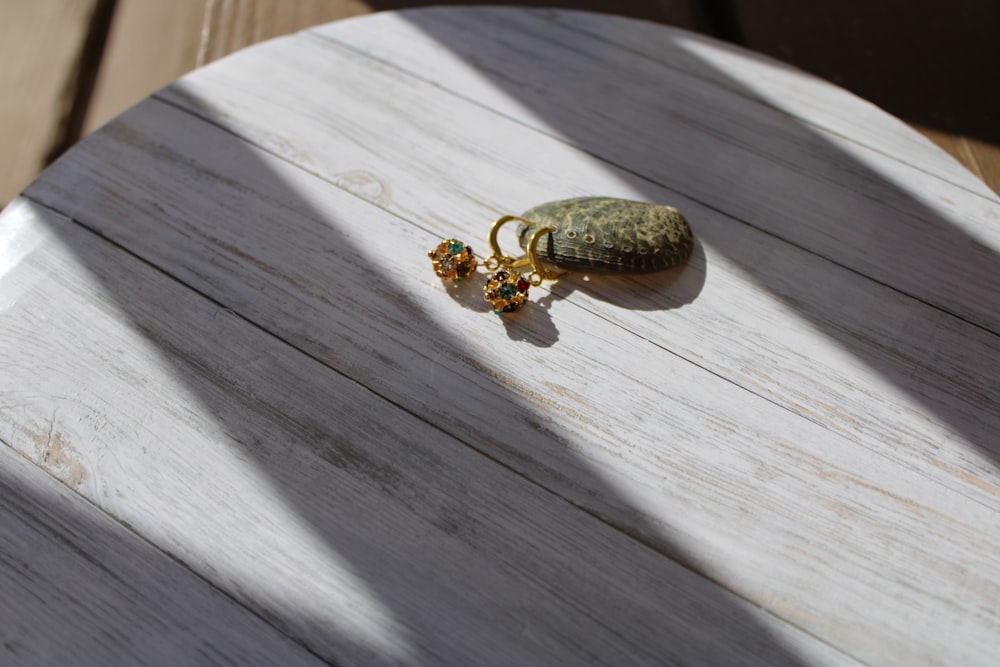 a wooden table with a ring on top of it