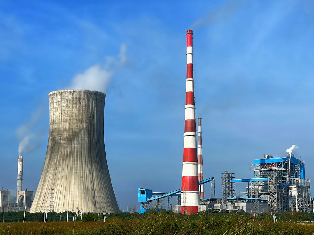 a factory with smoke coming out of it's stacks