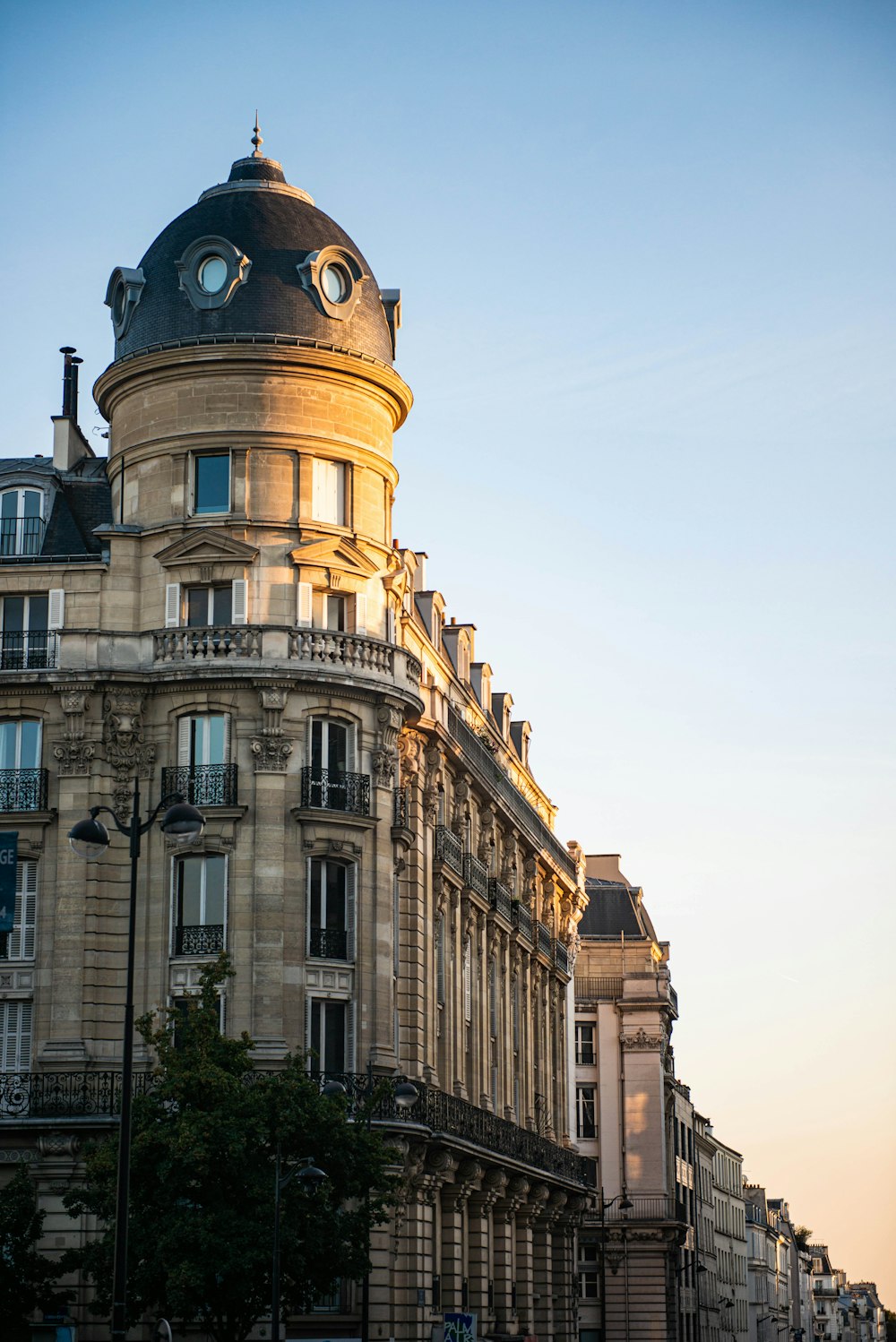 a tall building with a clock on the top of it