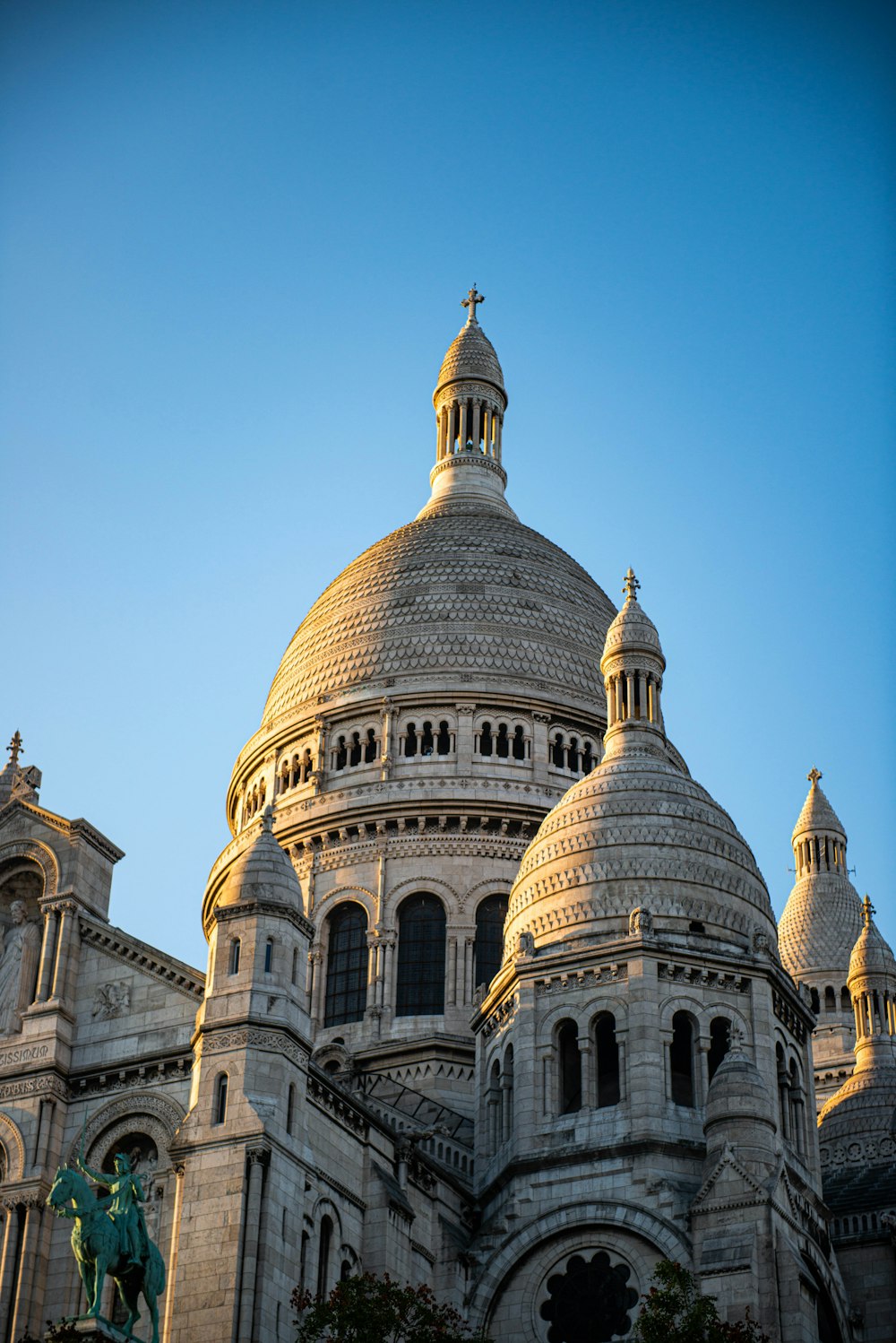 a large building with a cross on top of it