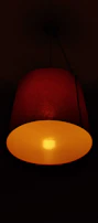 A red lamp casting a warm glow in a dim room.