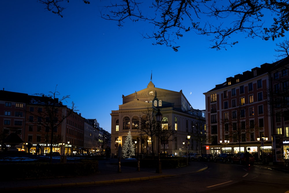 a building lit up at night in a city