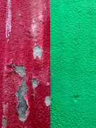 Before and after shots of a freshly painted living room wall.