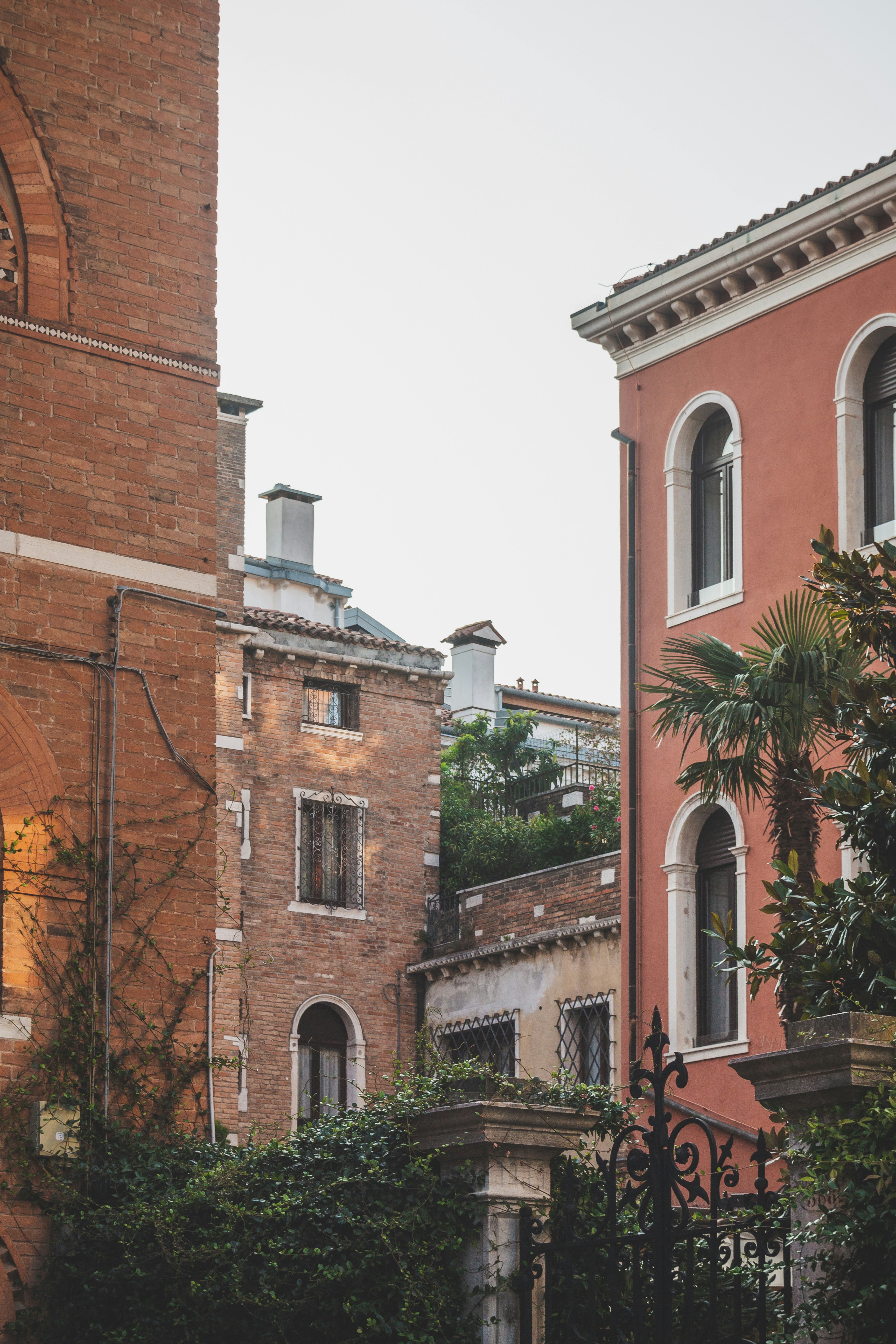 a brick building with a clock on the front of it