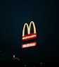 a mcdonald's restaurant sign lit up at night