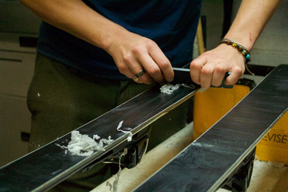 a man is using a pair of skis on a table