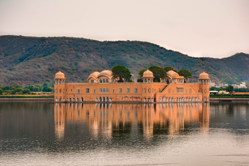 a large building sitting on top of a lake