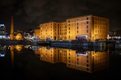 a large building sitting next to a body of water