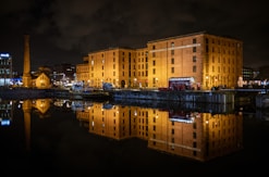 a large building sitting next to a body of water