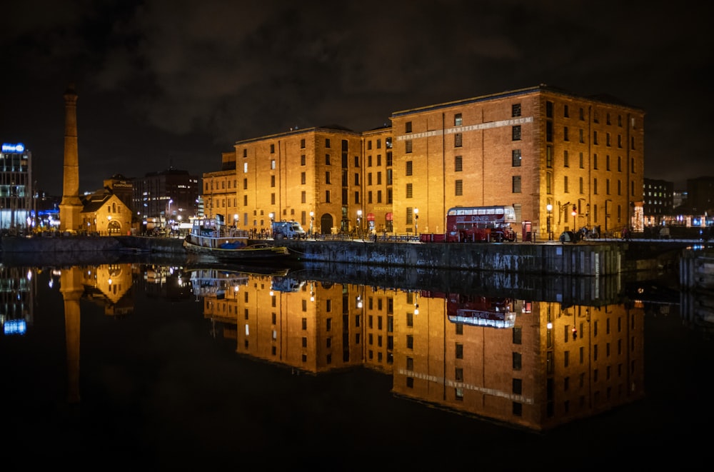 a large building sitting next to a body of water