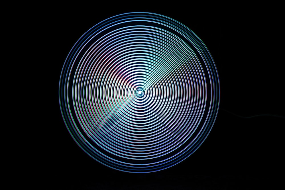 a circular object is shown in the dark