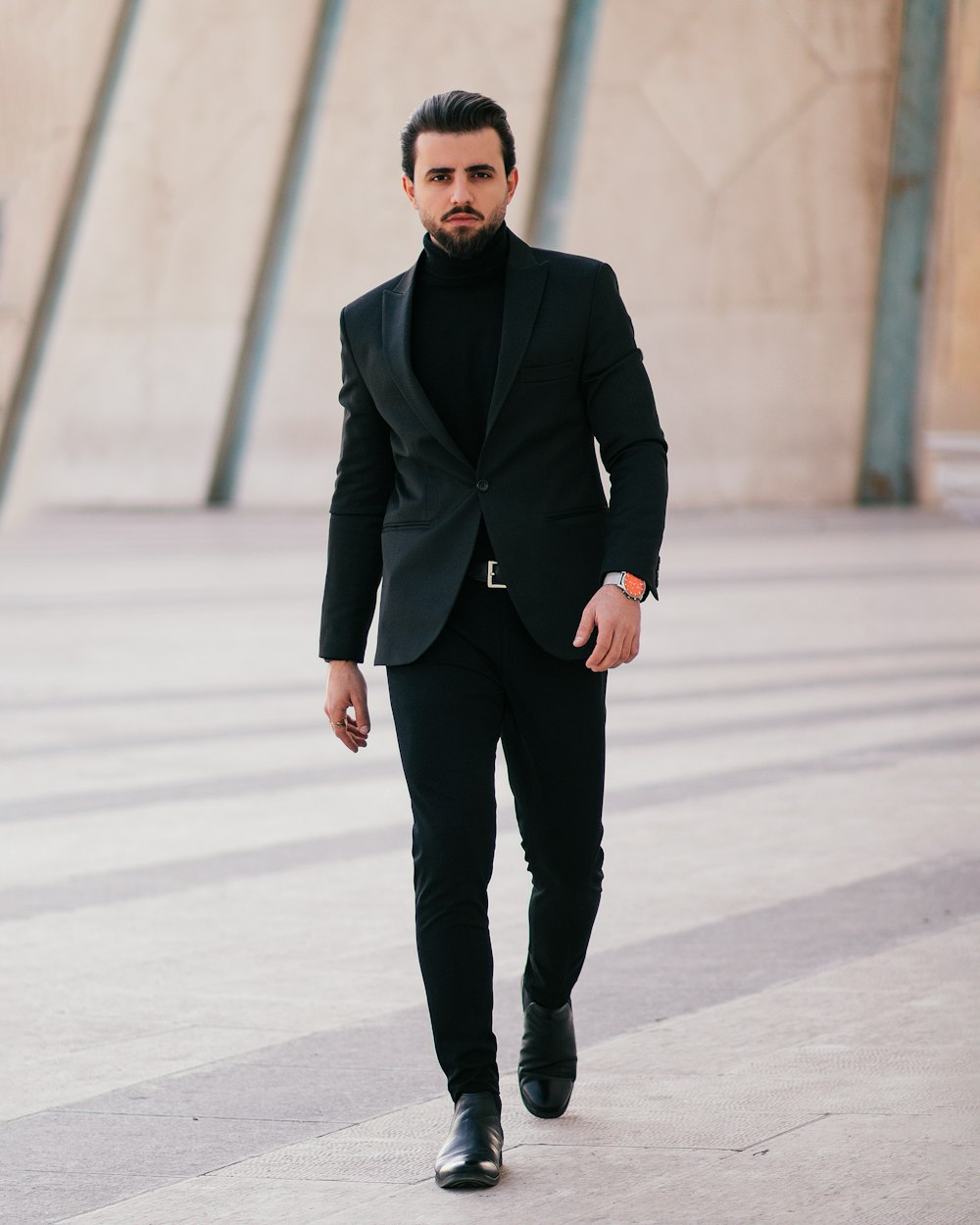 a man in a suit walking down the street