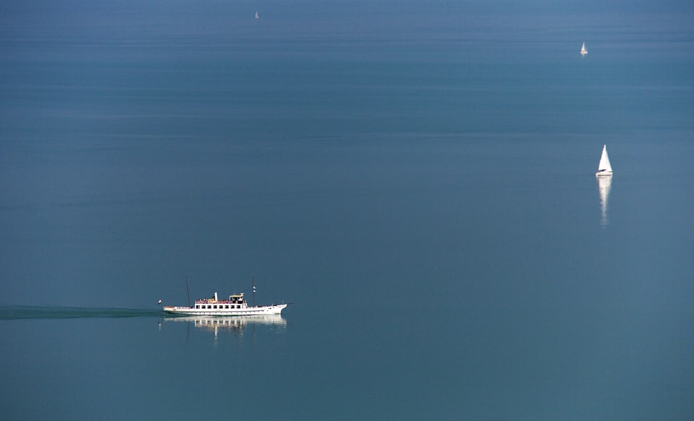 a boat floating in the middle of a large body of water