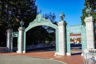 a blue and white gate with a bicycle parked in front of it