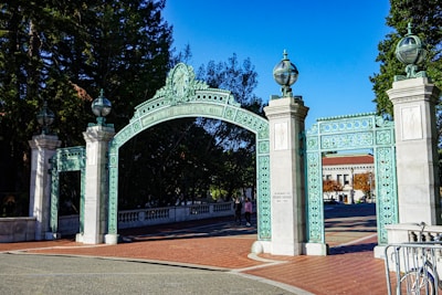 a blue and white gate with a bicycle parked in front of it