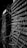 A close-up view of two stacks of old electrical components with numerous tangled wires connected to them. The image presents a complex and intricate pattern of cables that weave in and out of grid-like structures, suggesting an antiquated or retro technology setup. The black and white color scheme adds a dramatic and historical feel to the scene.