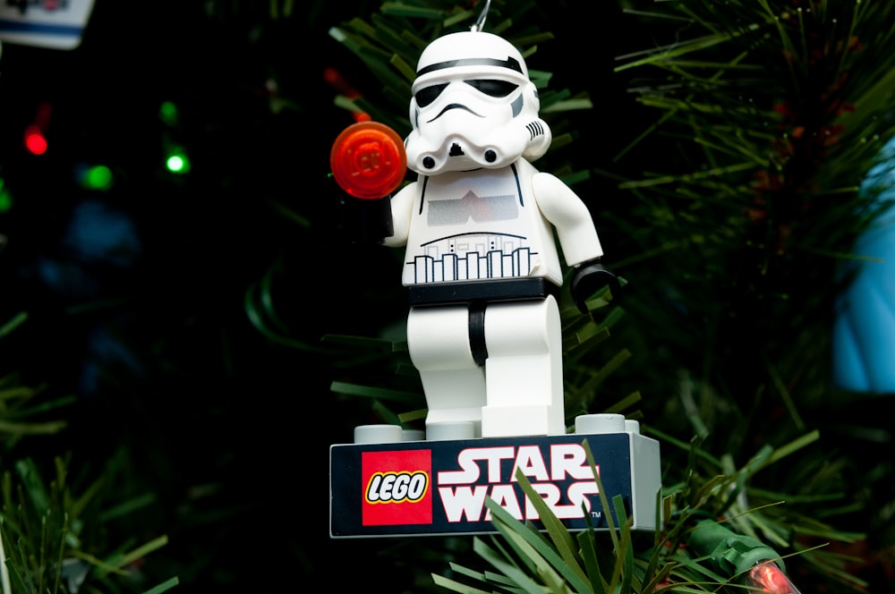 a lego star wars ornament hanging from a christmas tree