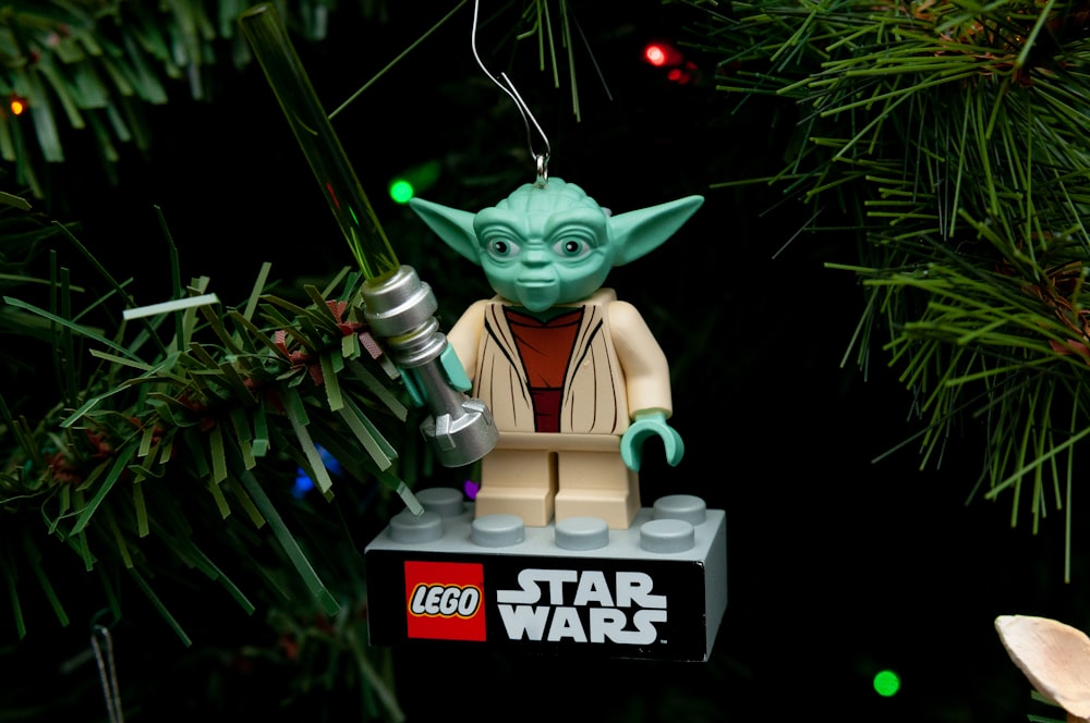 a lego star wars ornament hanging from a christmas tree