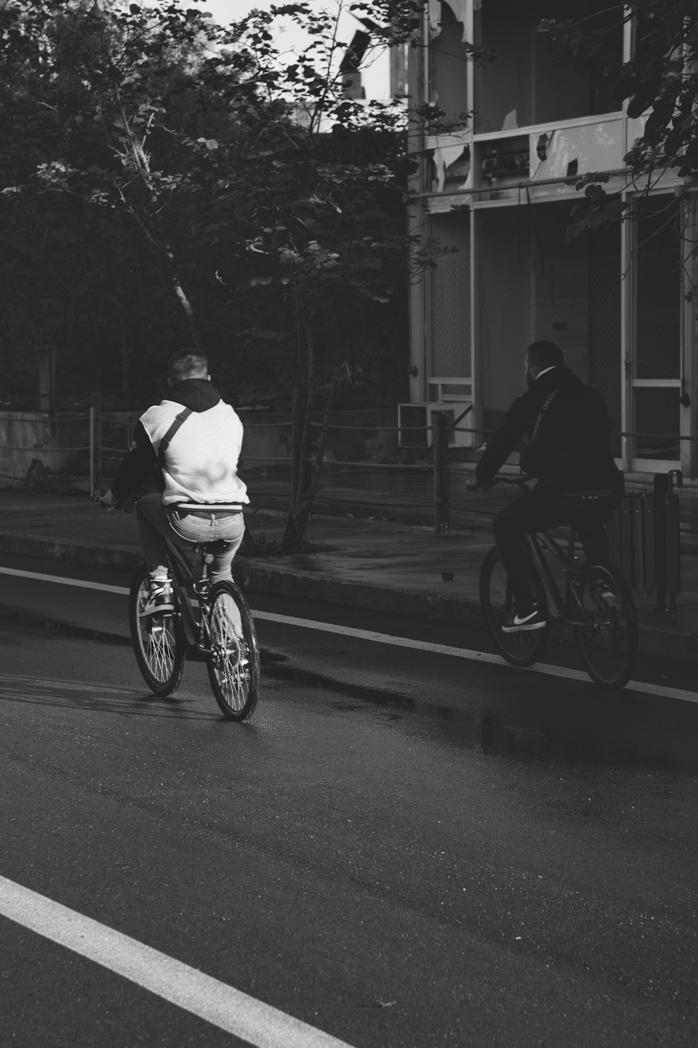 a person riding a bike down a street