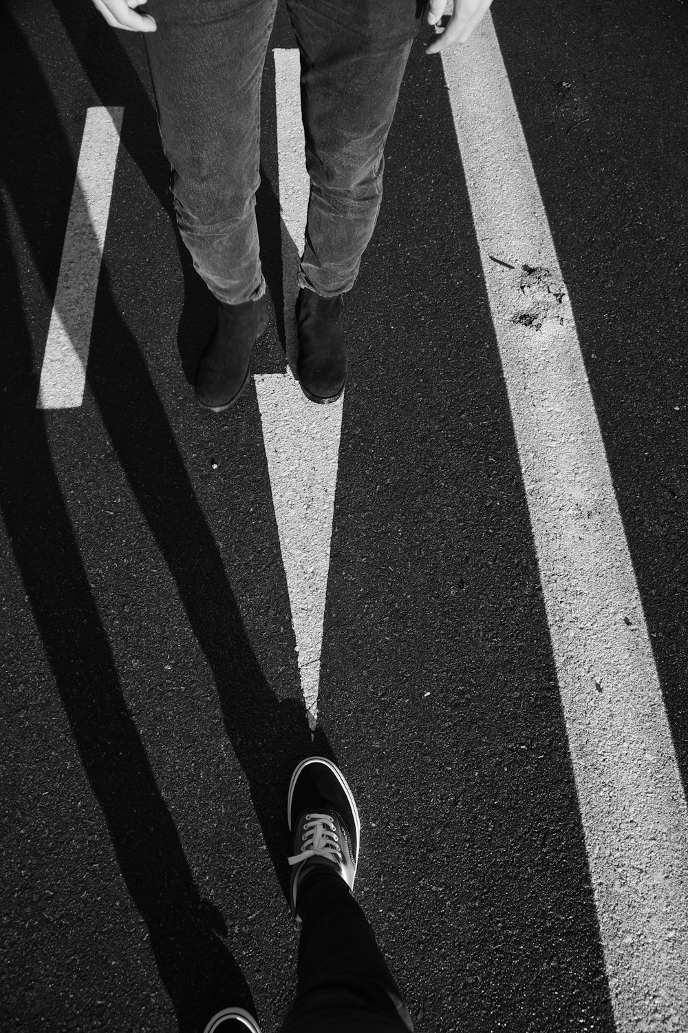 a person standing in the middle of a parking lot